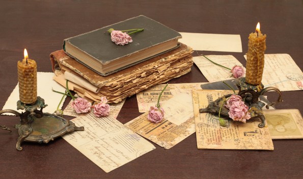 vintage_books_old_flowers_roses_candles_candle_holders_letters_cards_paper_table_74949_4752x2808